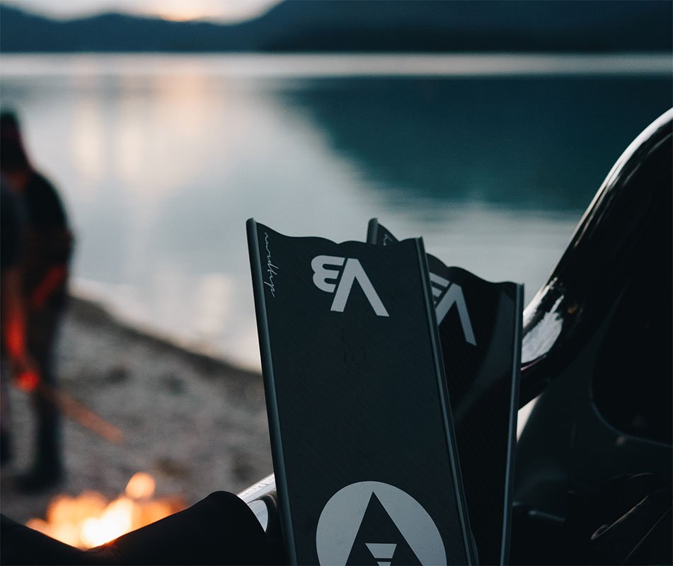 Alchemy V3 Carbon Fiber Bifins, in Silver by a camp fire
